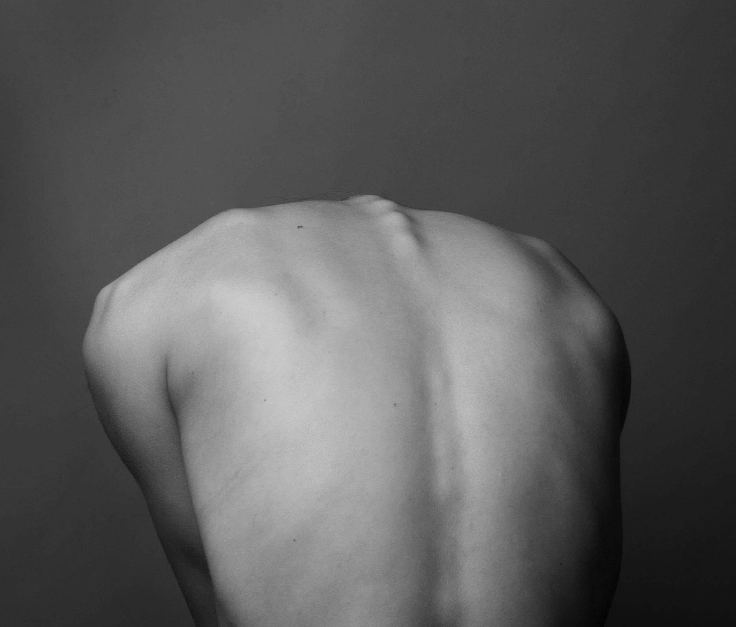 A back of a person. A back of a person.
