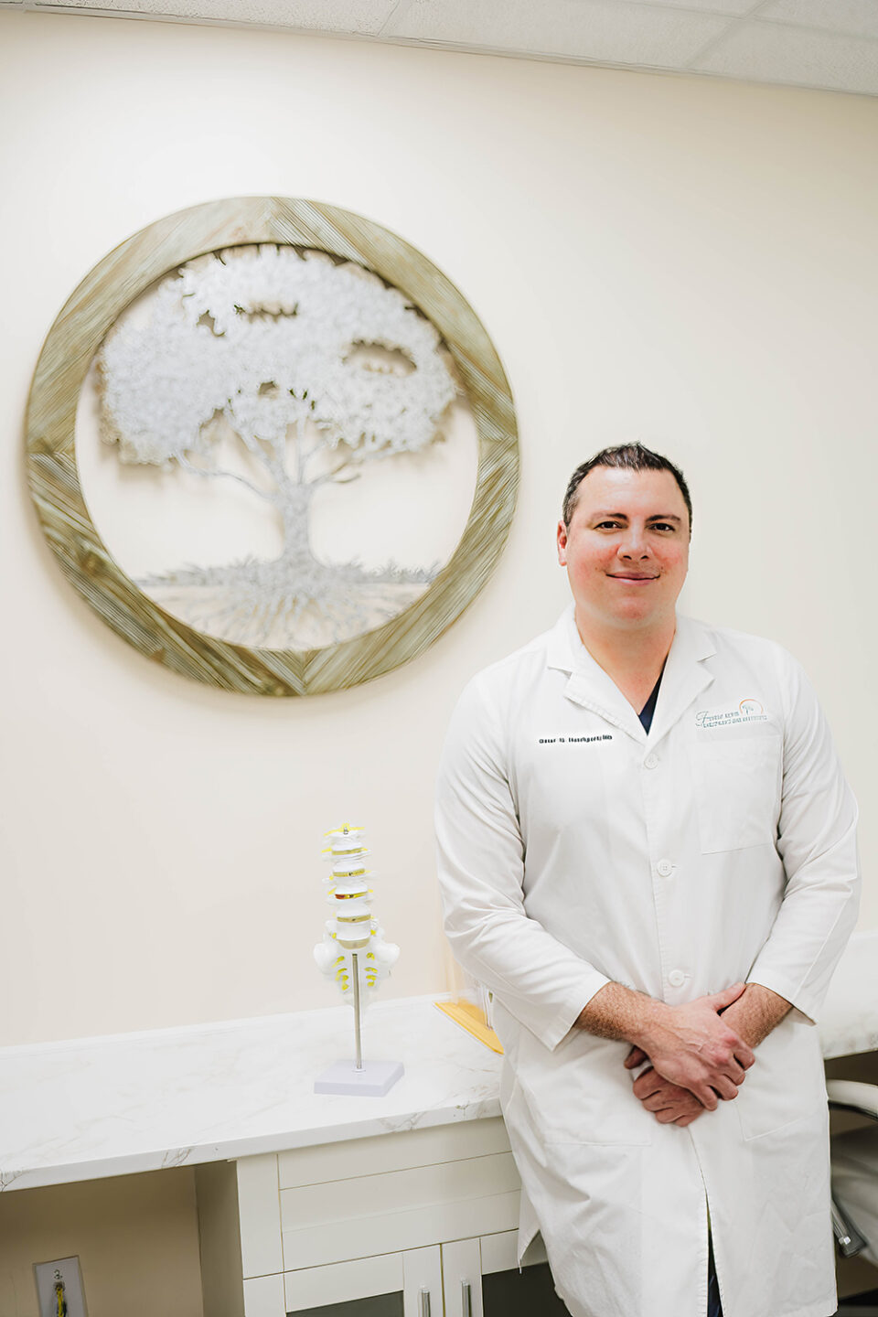 A man in a white coat.