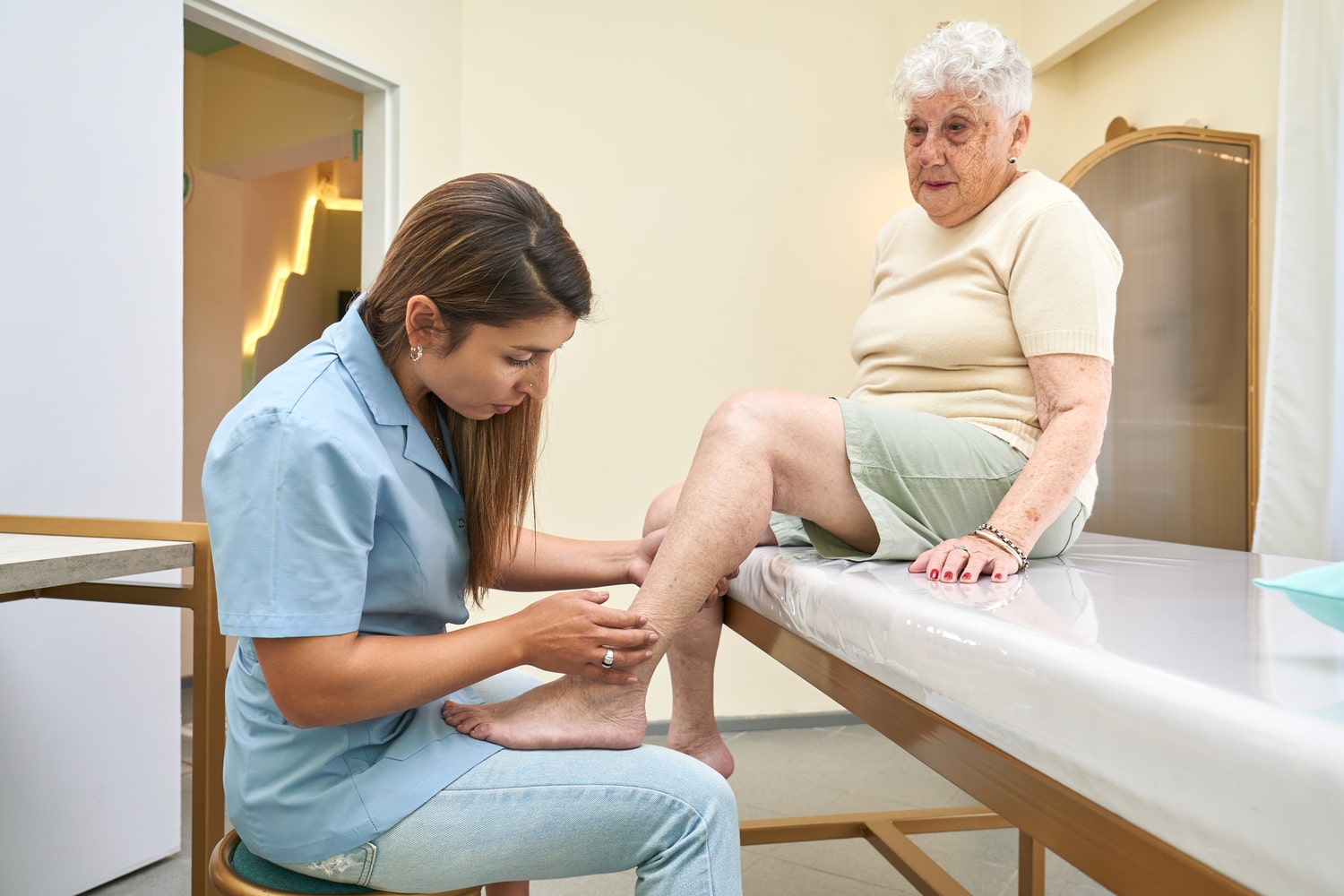 A nurse checking on an elderly woman