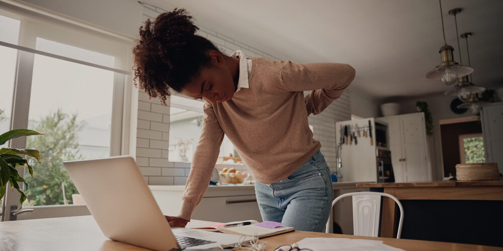 black woman with hurt back chronic pain treatement venice and port charlotte fl