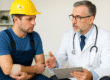 A doctor discusses recovery options with an injured worker wearing a hard hat and arm bandage in a bright medical office, illustrating compassionate care and Workers’ Comp recovery services in Venice and Port Charlotte, FL.
