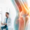 A doctor talks to a woman in an exam room with a large, semi-transparent illustration of a knee joint overlaid in the foreground discussing stem cell therapy for joint pain.